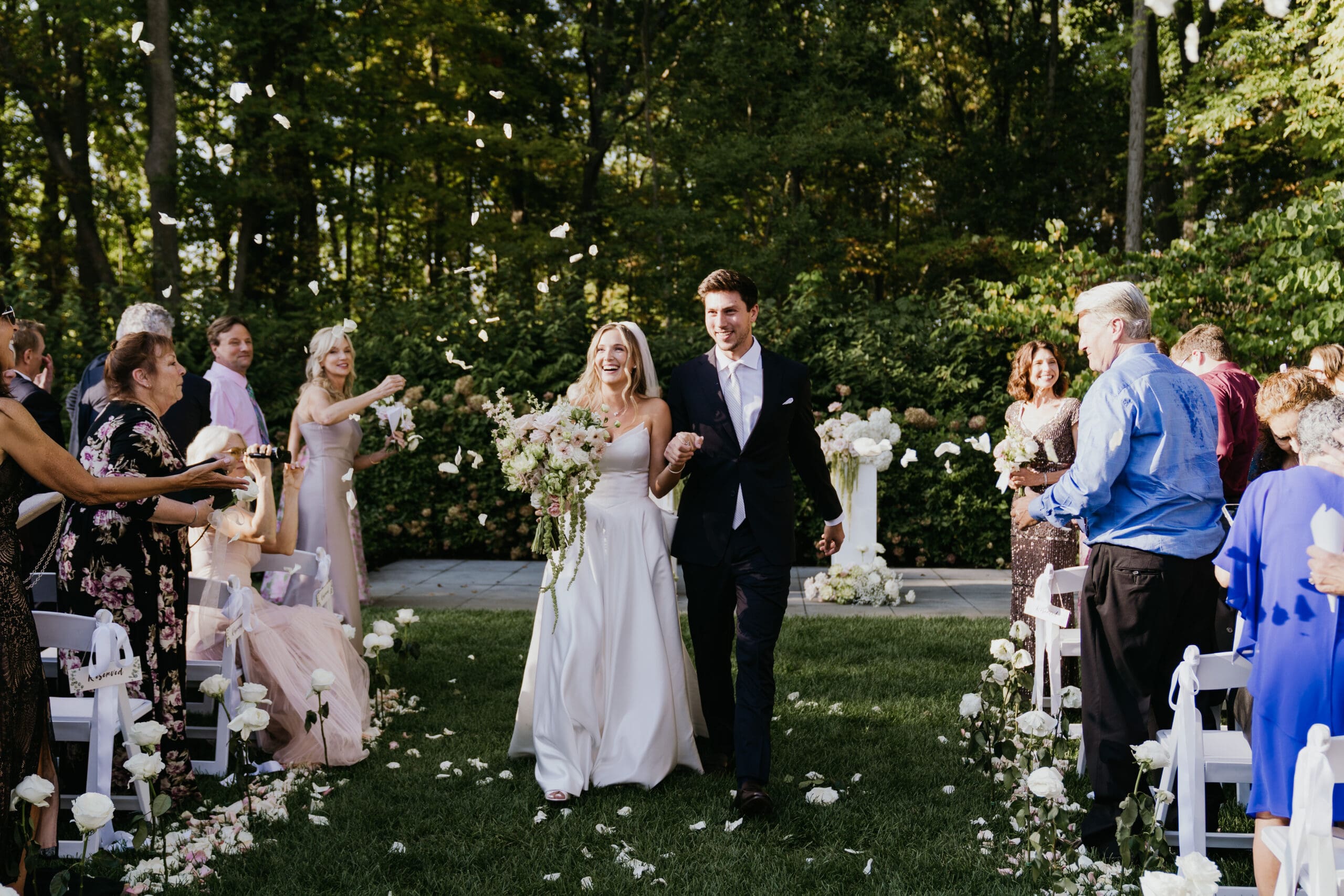 Highfields Event Center Fall Wedding day with couple walking down the isle after saying I do.